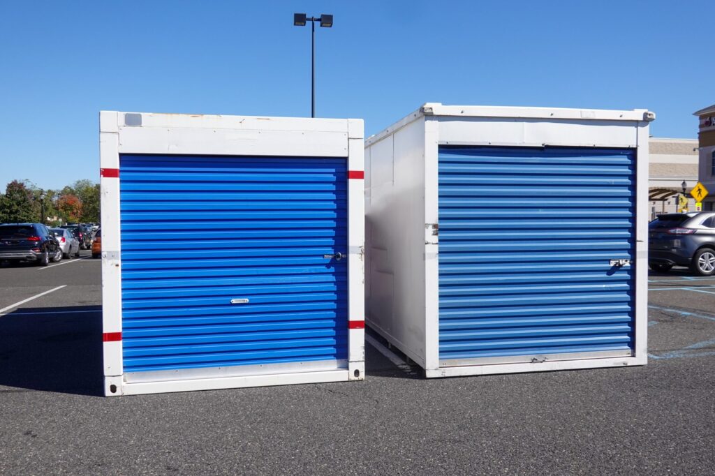 two,white,storage,pod,containers,with,a,blue,door,on